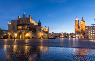 The Main Market Square in Krakow, Poland, with famous Sukiennice (Cloth hall) and St Mary's church in blue hour