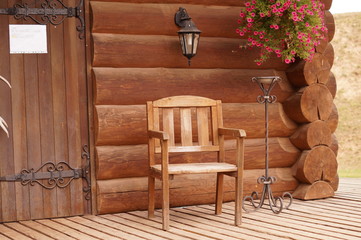 Fototapeta na wymiar Wood chair wood house flowers