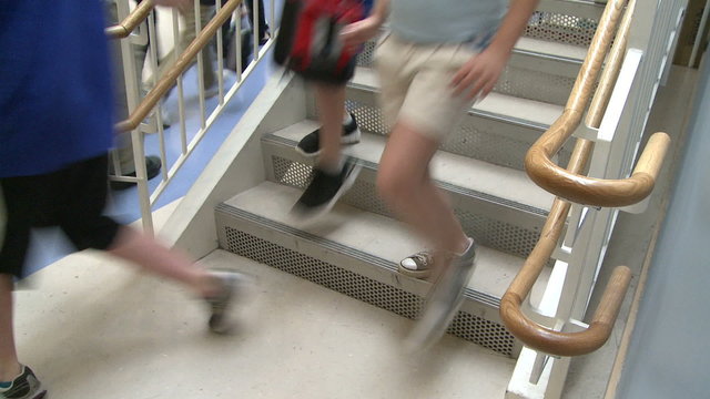 Grammar school students walking down the stairs