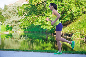 young beautiful jogging woman in park