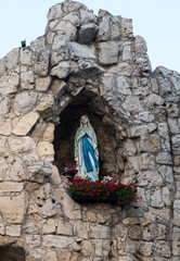 Statue of Virgin Mary in the grotto of the international shrine