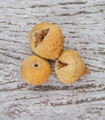 Dried fig over rustic wooden background