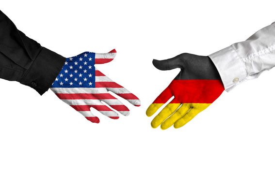 United States and Germany leaders shaking hands on a deal agreement