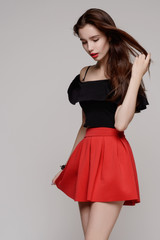 woman in red dress with long curly hair