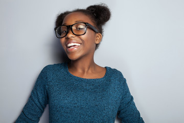 Happy young girl in eyeglasses.