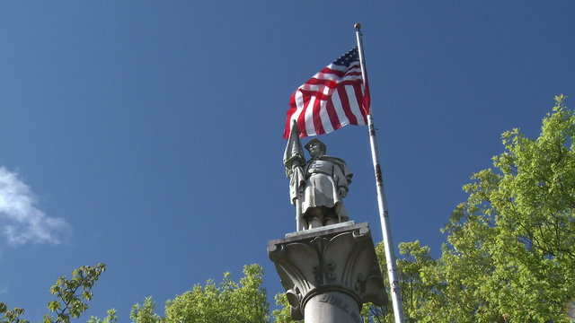 Monument next to American Flag