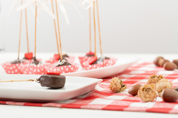 Cake-pop on wooden table.