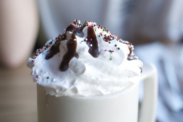 hot chocolate with whipped cream and sprinkles