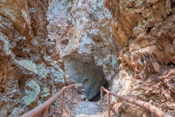 pathway underground cave with stalagmites and stalactites