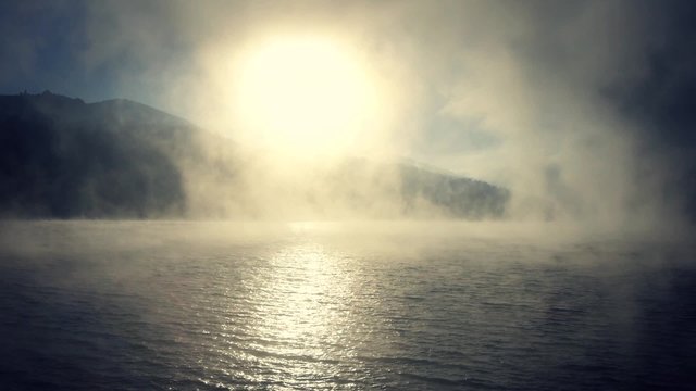 Foggy sunrise on the lake.

