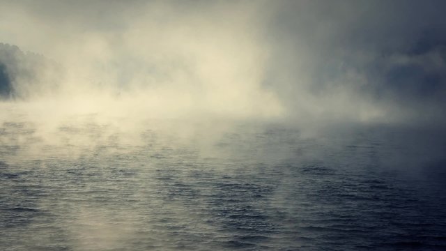 Foggy sunrise on the lake.
