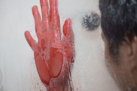 Bloody hand in bathroom
