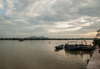 Cloudy sunset on the Thu Bon river. Hoi An, Vietnam.