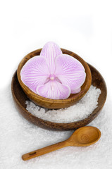 Obraz na płótnie Canvas bowl of orchid with salt and leaf ,spoon n towel