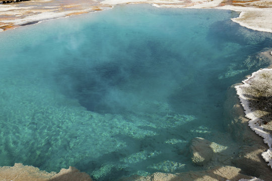 Clear, aqua, thermal pool, steaming in Yellowstone Park, Wyoming