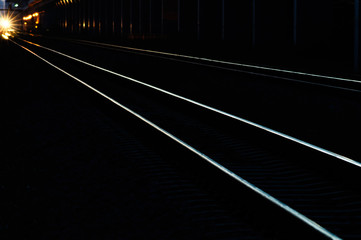 railway tracks in the shadow light of sunset.