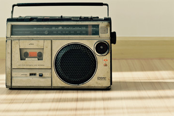 Dusty old radio with one cassette player