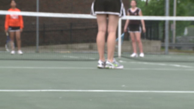 High school girls at tennis practice