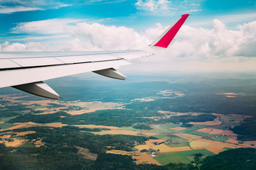 Sky view from airplane window. The window seen forests and color