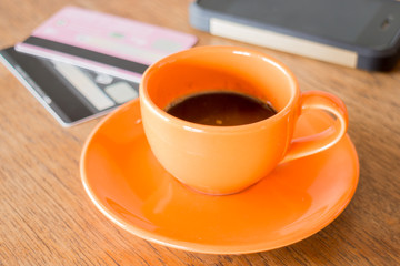 Hot coffee cup on wooden table