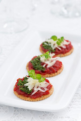 crackers with beetroot pate and pesto, vertical