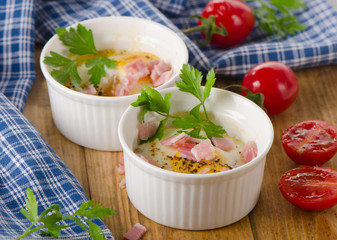 Baked eggs with tomatoes and bacon.