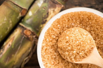 Brown sugar close-up on wooden spoon