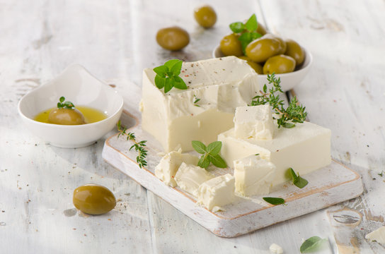 Feta with olives and fresh herbs.