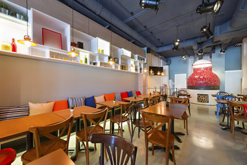 Interior of a pizza restaurant with woode fired oven