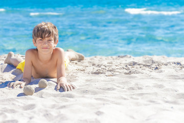Fototapeta na wymiar outdoor portrait of young european child boy enjoying summer vac
