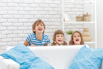 indoor portrait of young happy smiing children, kids, boy and gi