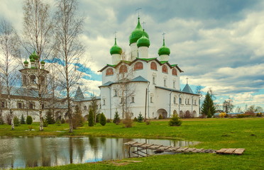 near Veliky Novgorod is beautiful ensemble Vyazhischskogo monastery, built in upper reaches of river Veryazhi. magnificent buildings of monastery solemnly look at background of surrounding nature.