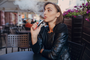 beautiful glamorous brunette smoke electronic cigarette