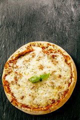 Melted mozzarella cheese on a margarita pizza