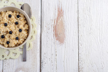Obraz na płótnie Canvas Oatmeal porridge for breakfast, top view