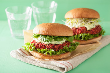 veggie beet and quinoa burger with avocado dressing