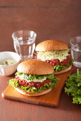 veggie beet and quinoa burger with avocado dressing