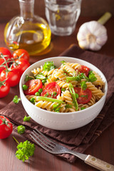 vegetarian pasta fusilli with tomato peas herbs