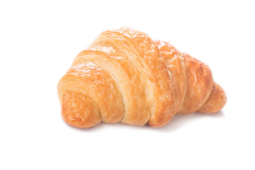 Fresh and tasty croissant on white background