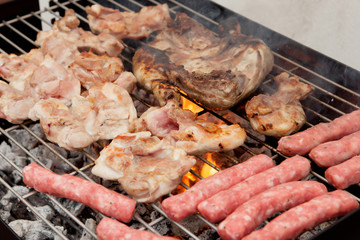 Chicken and sausages on the barbecue
