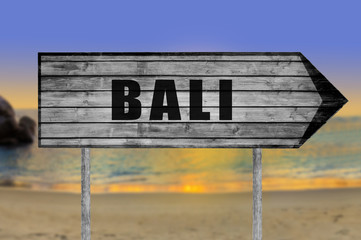 Bali wooden sign with beach background