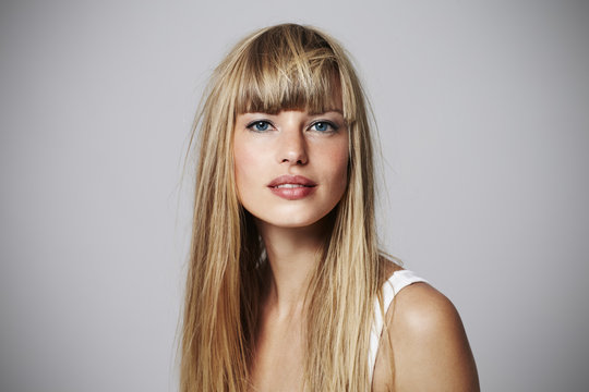 Alluring young blond woman in studio