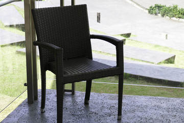black rattan chair on the terrace