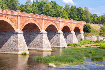 Fototapeta premium andscape with old brick bridge