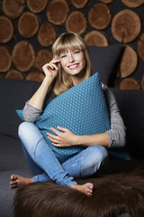 Obraz premium Young woman relaxing at home, portrait