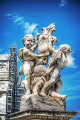 Fototapeta na wymiar Putti fountain in Piazza dei Miracoli in Pisa