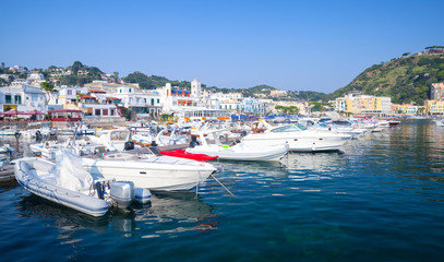 Fototapeta na wymiar Pleasure boats moored in Lacco Amen, Ischia