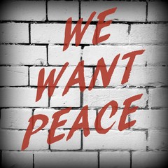 The words We Want Peace in red text on a brick wall background, processed in black and white for...