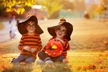 Two boys in the park with Halloween costumes