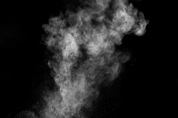 abstract white dust explosion  on a black background. abstract white powder. design elements. abstract texture.